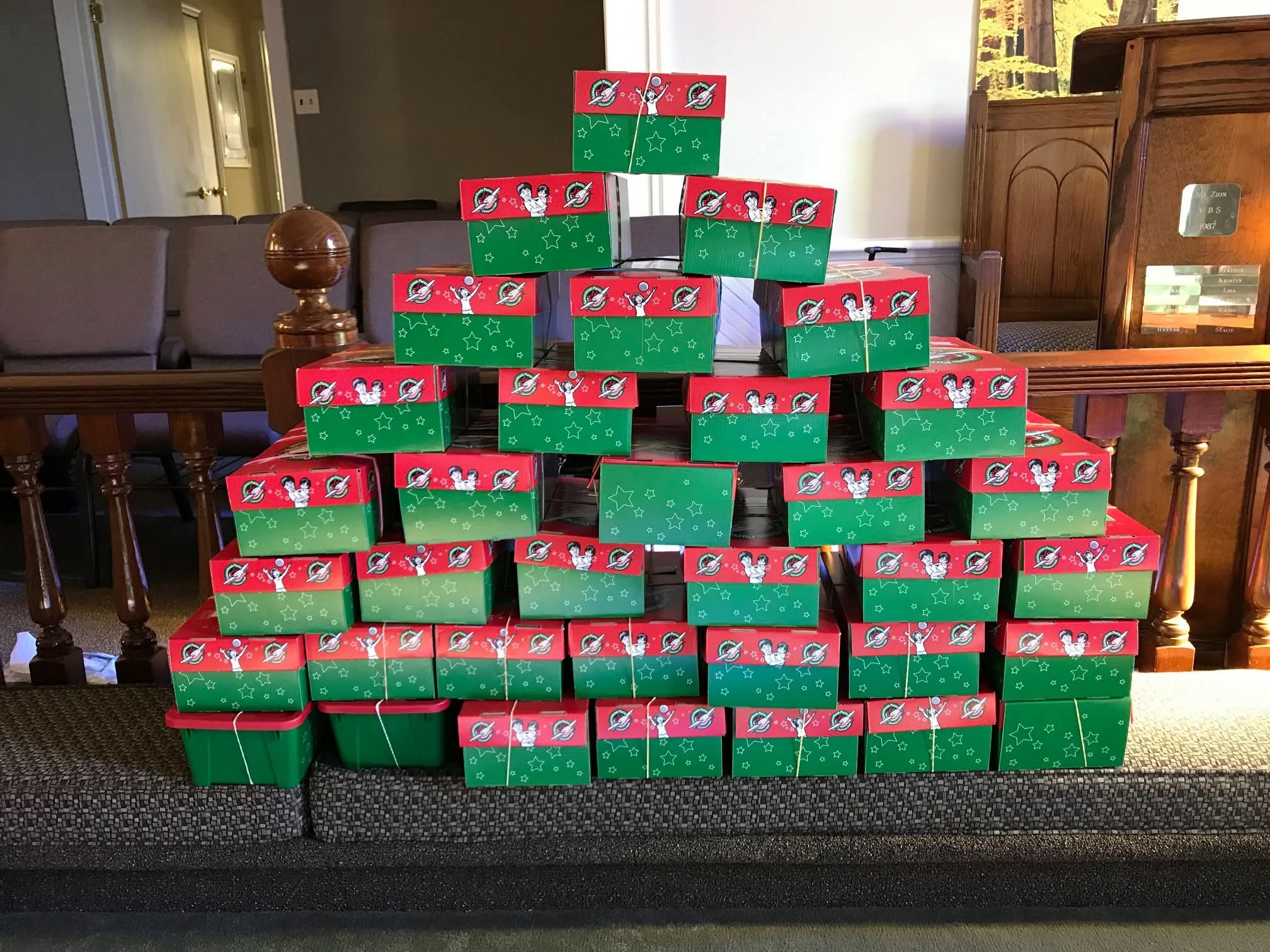 Stack of Operation Christmas Child shoeboxes packed